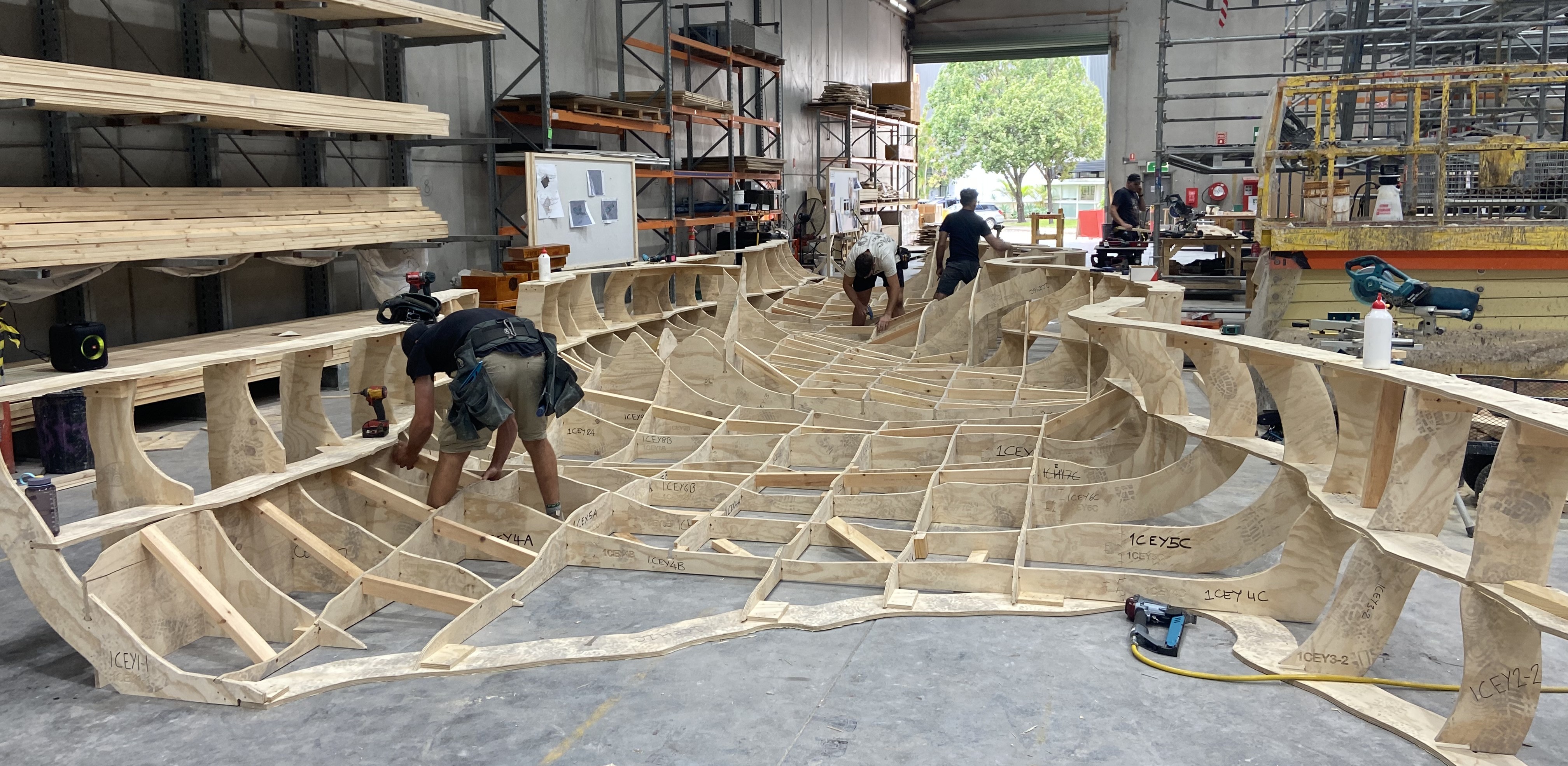 CNC-cut plywood cave formers being assembled in the workshop.