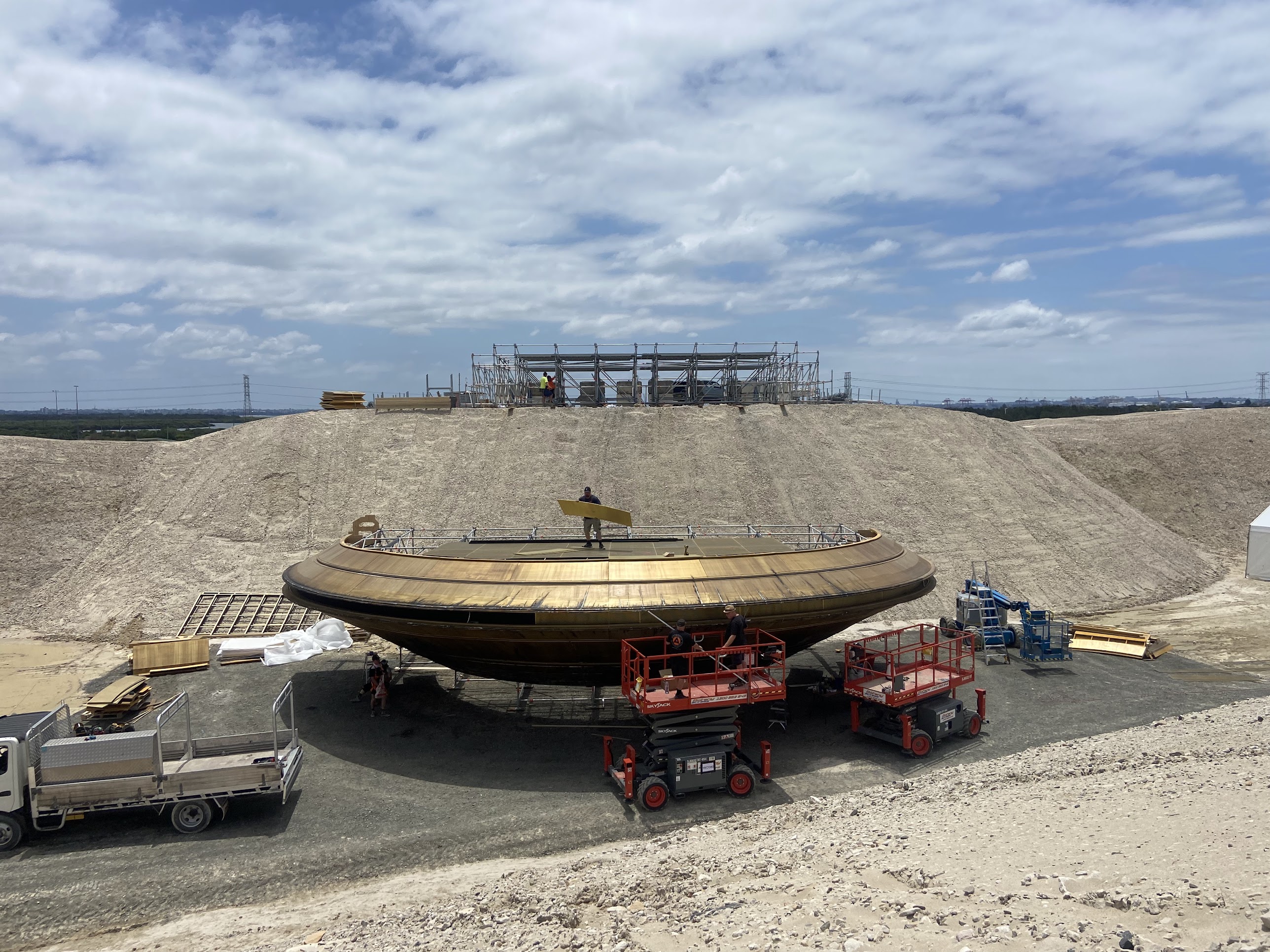 Hero UFO under construction at ground level before lift.